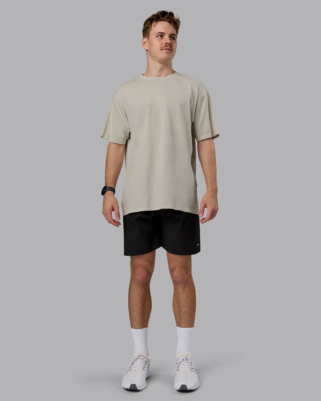 Man wearing Heart FLXCotton Oversized Tee - Washed Shale Beige-White | Model:Cameron | Size:M