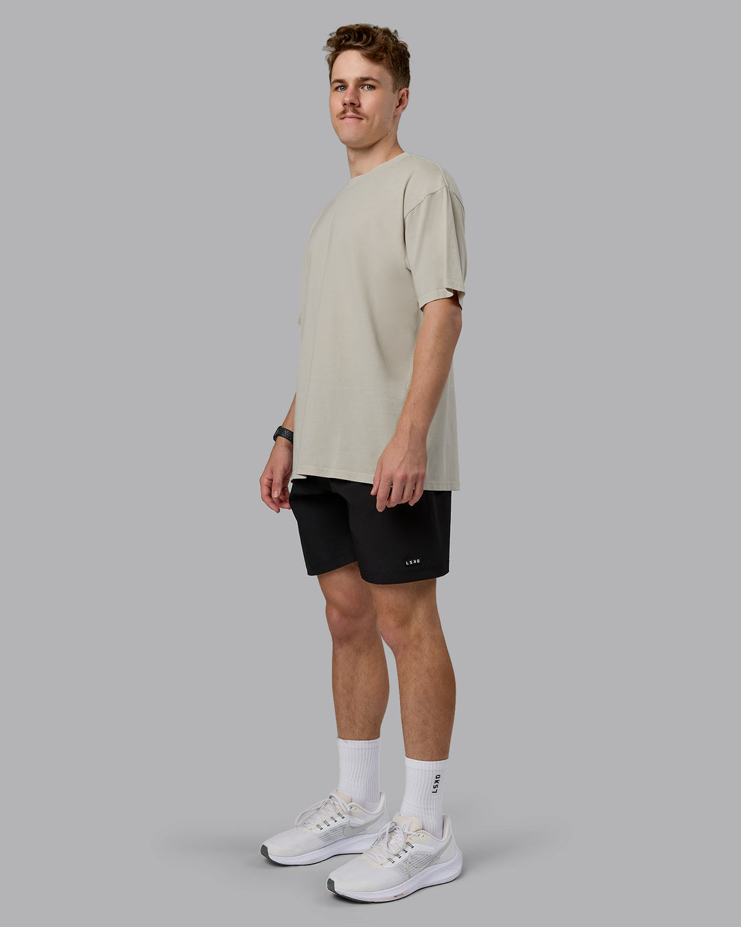 Man wearing Heart FLXCotton Oversized Tee - Washed Shale Beige-White | Model:Cameron | Size:M