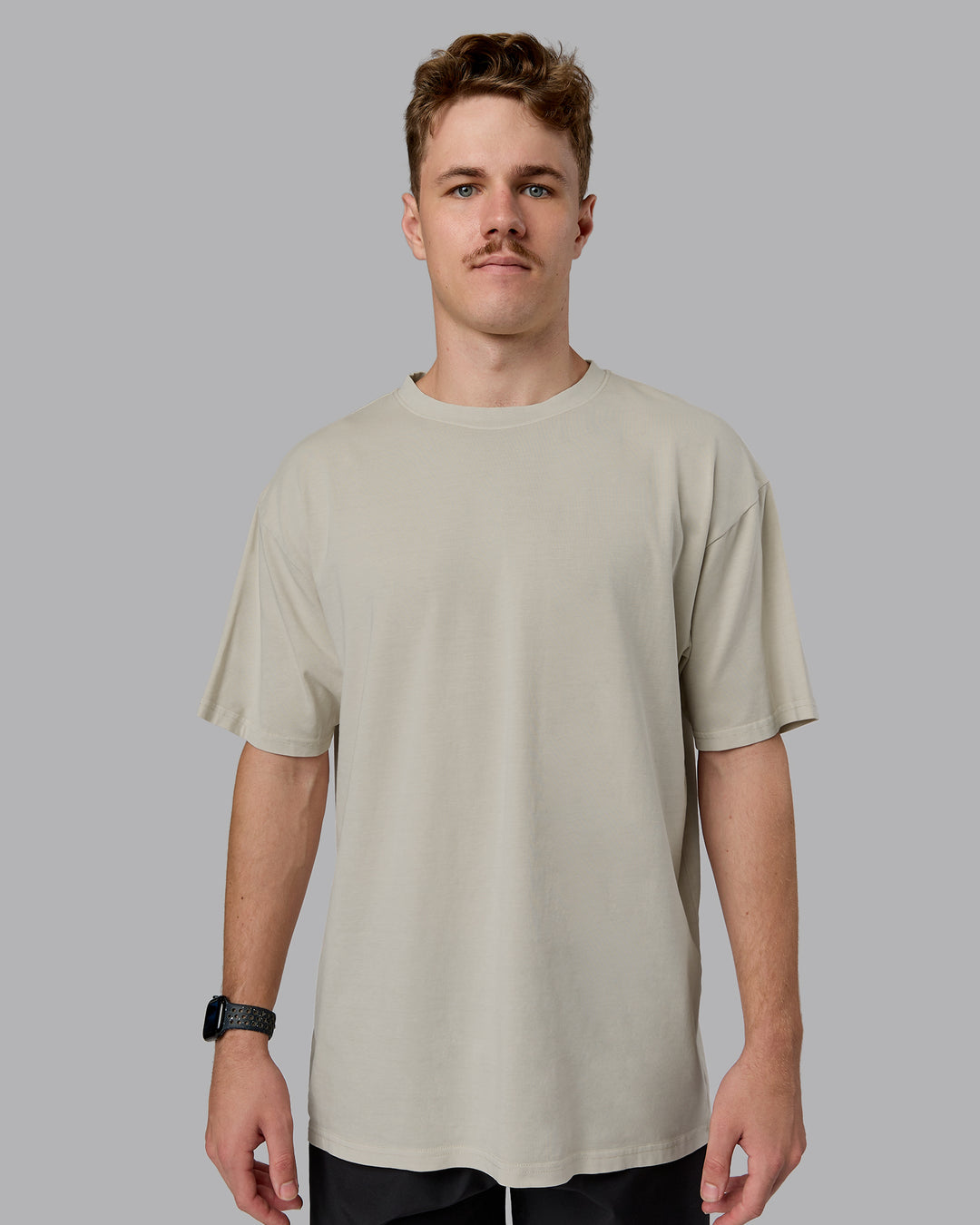 Man wearing Heart FLXCotton Oversized Tee - Washed Shale Beige-White | Model:Cameron | Size:M
