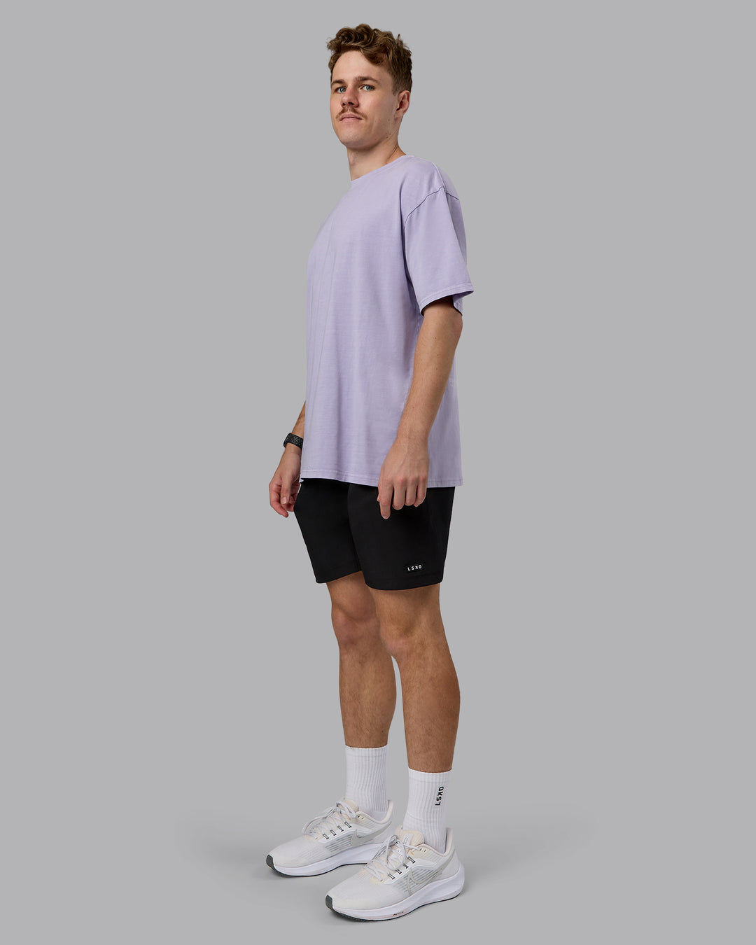 Man wearing Heart FLXCotton Oversized Tee - Washed Violet Ray-White | Model:Cameron | Size:M