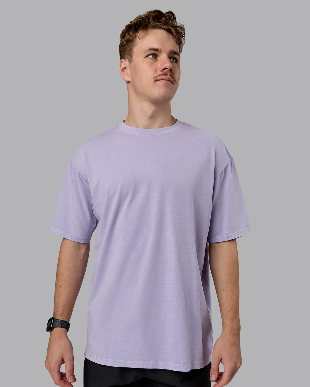 Man wearing Heart FLXCotton Oversized Tee - Washed Violet Ray-White | Model:Cameron | Size:M