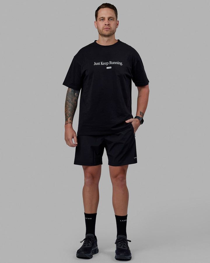 Man wearing Unisex Just Keep Running FLXCotton Tee Oversize - Black-White
