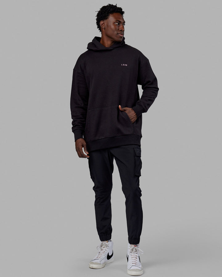 Man wearing Unisex Lift-Up Hoodie Oversize - Black
