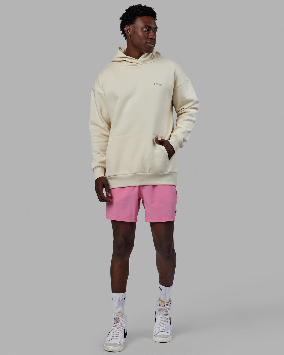 Man wearing Unisex Lift-Up Hoodie Oversize - Warm White