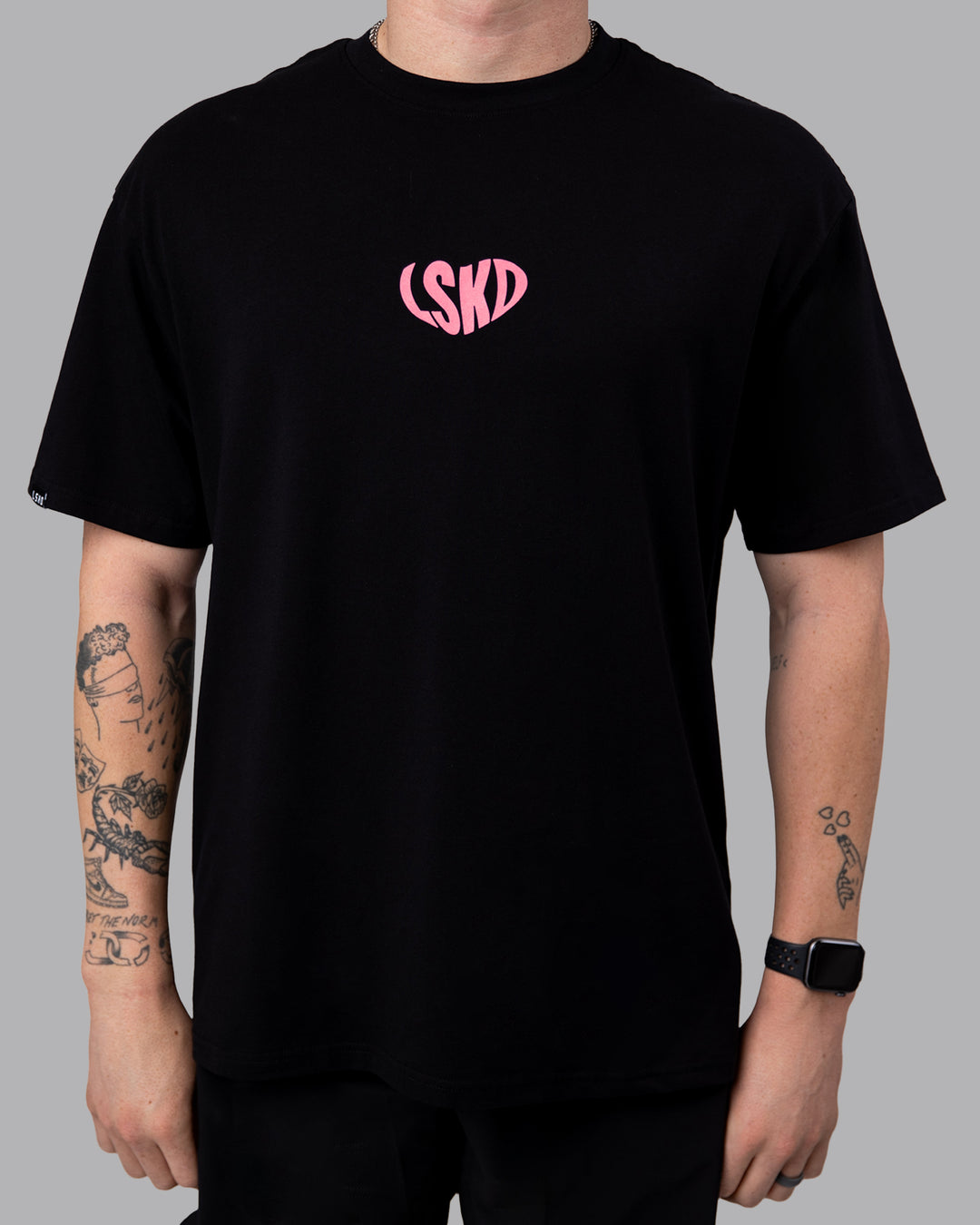 Man wearing Unisex Love To Train FLXCotton Tee Oversize in Black-Pink Lemonade | Size:M