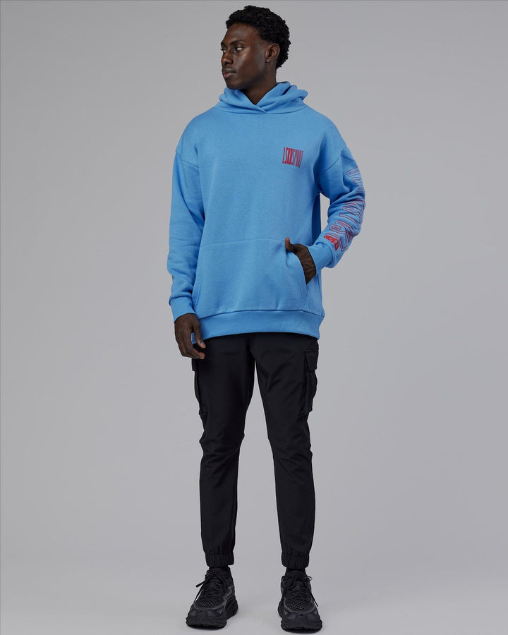 Man wearing Unisex Stretch It Hoodie Oversize - Azure Blue