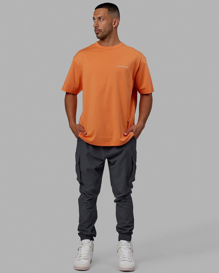 Man wearing Unisex Taylor Tee Oversize - Tangerine