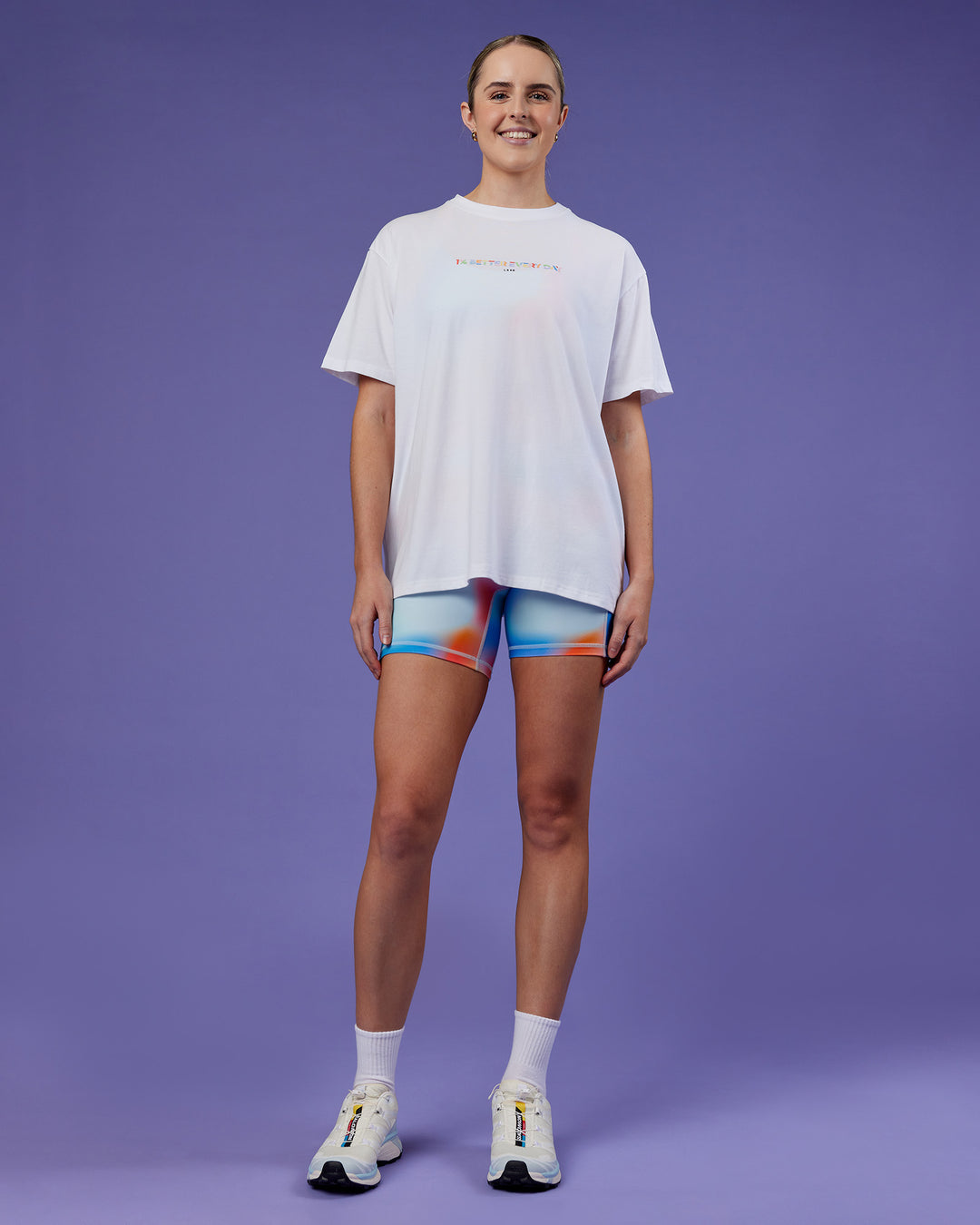 Woman wearing Unity Go-To FLX Cotton Tee - White-Rainbow | Model:Mon | Size:M
