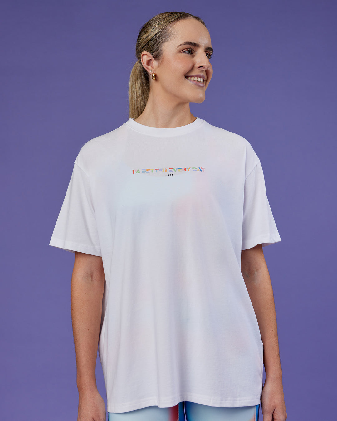 Woman wearing Unity Go-To FLX Cotton Tee - White-Rainbow | Model:Mon | Size:M
