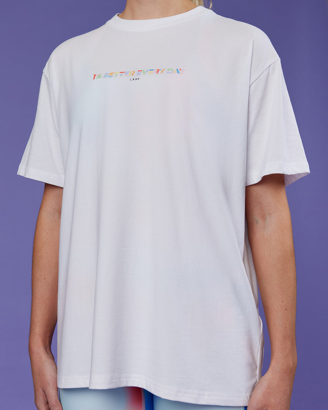 Woman wearing Unity Go-To FLX Cotton Tee - White-Rainbow | Model:Mon | Size:M