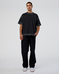 Man wearing Urban Blur Heavyweight Unisex Oversized Tee - Black-Dark Storm | Model:Zoran | Size:M
