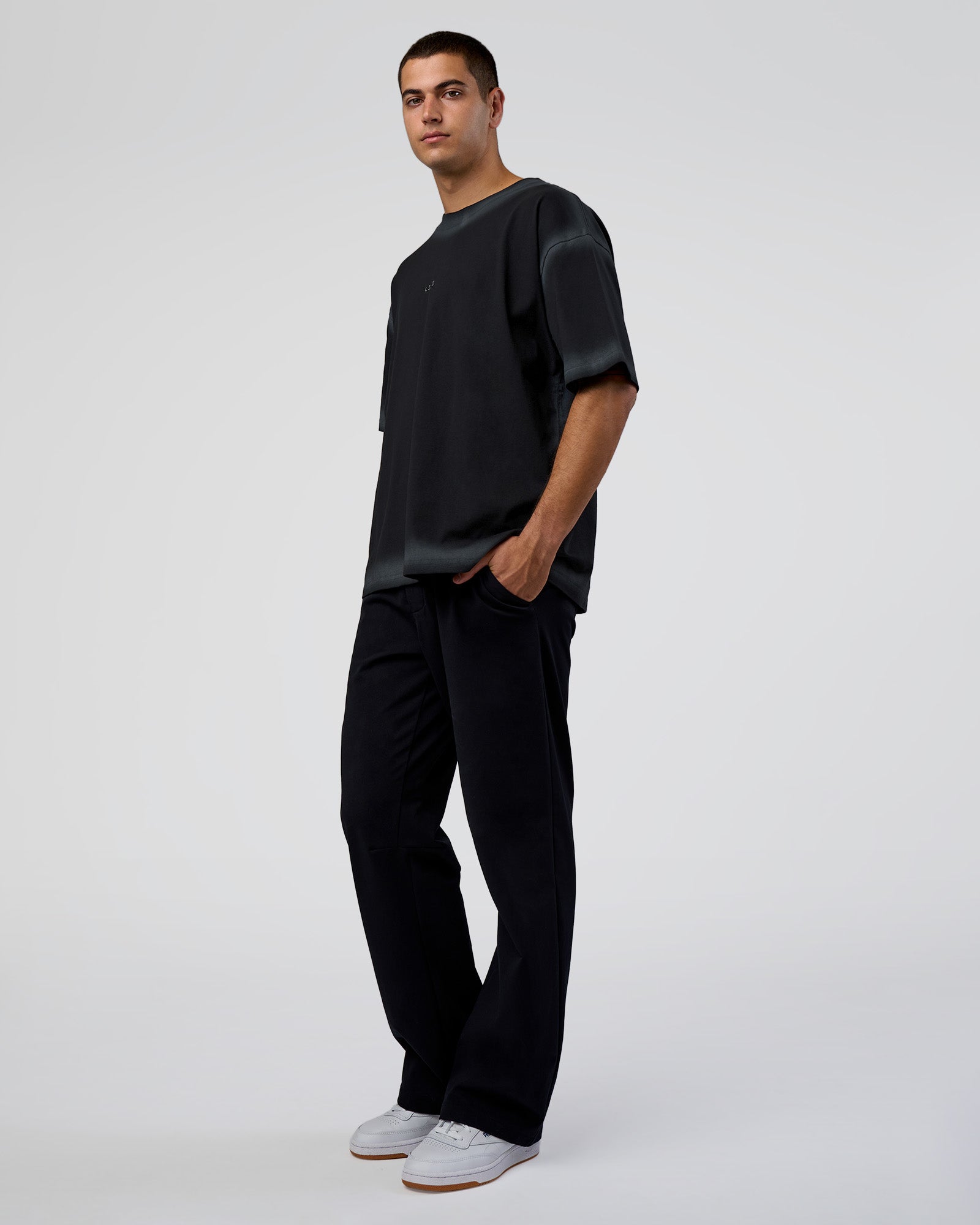 Man wearing Urban Blur Heavyweight Unisex Oversized Tee - Black-Dark Storm | Model:Zoran | Size:M