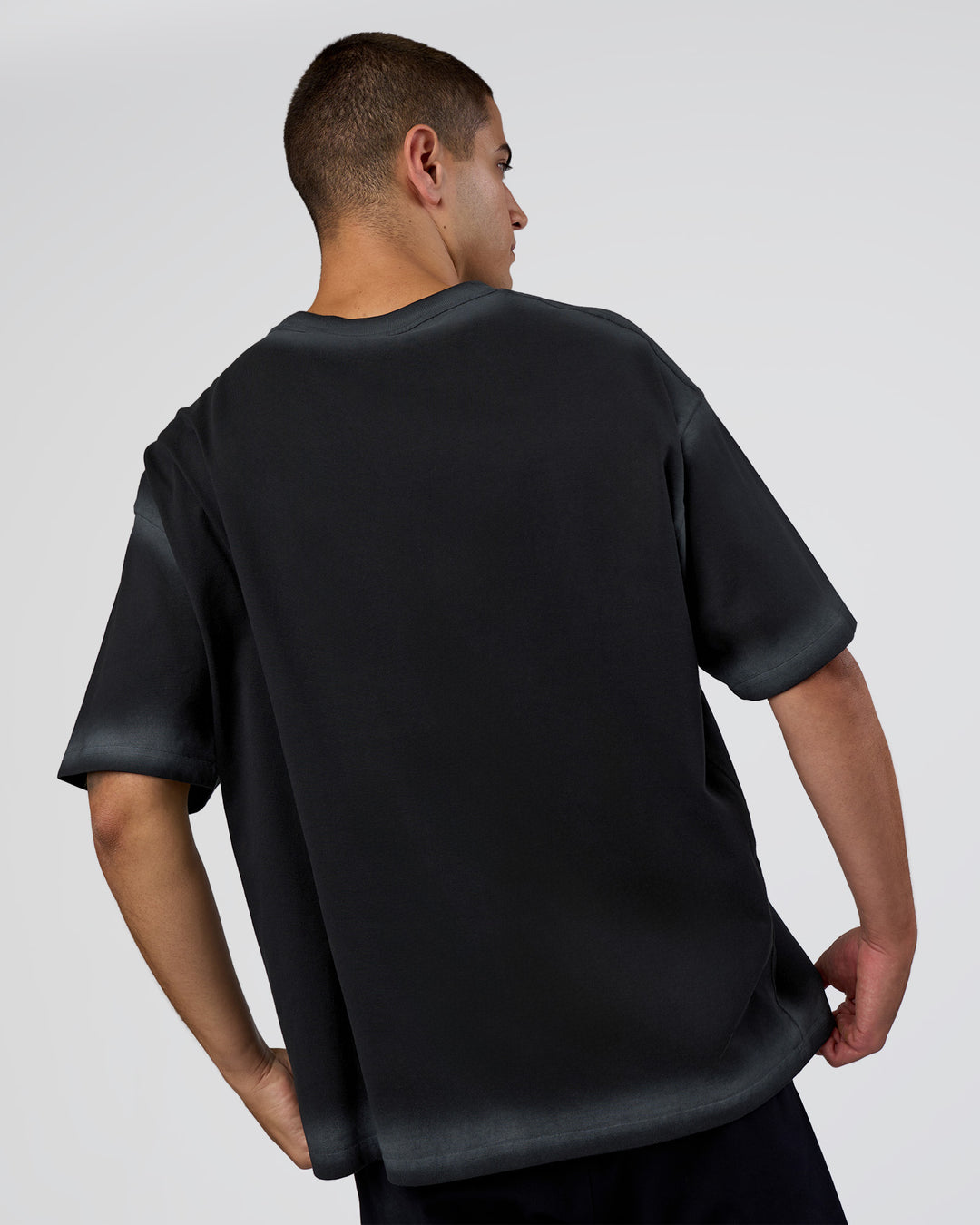Man wearing Urban Blur Heavyweight Unisex Oversized Tee - Black-Dark Storm | Model:Zoran | Size:M