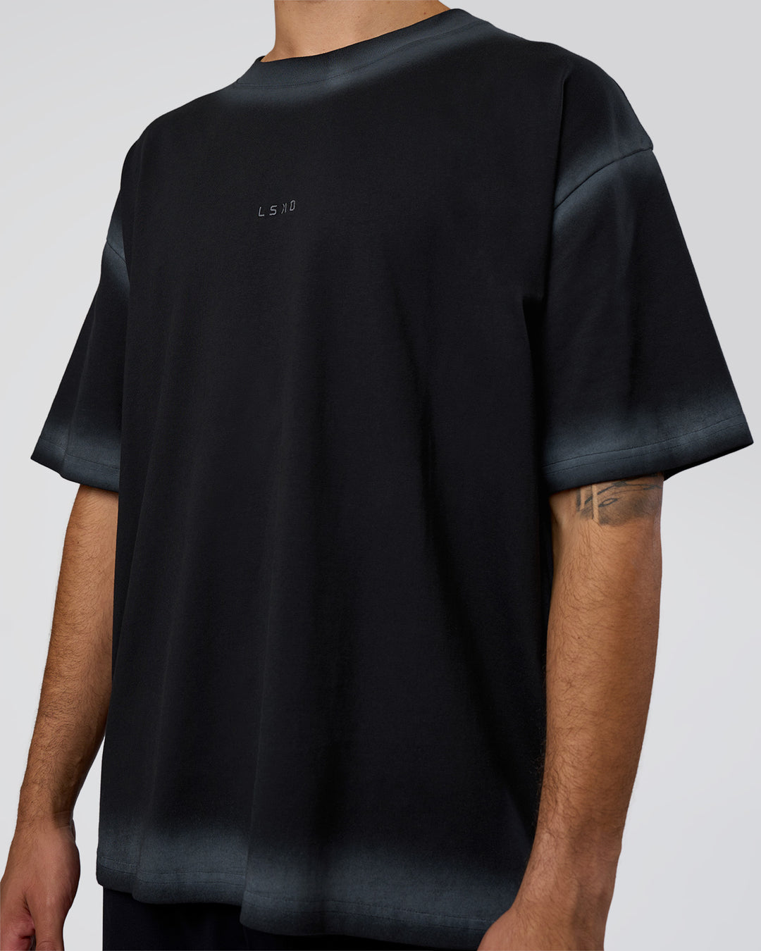 Man wearing Urban Blur Heavyweight Unisex Oversized Tee - Black-Dark Storm | Model:Zoran | Size:M