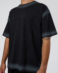 Man wearing Urban Blur Heavyweight Unisex Oversized Tee - Black-Dark Storm | Model:Zoran | Size:M