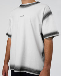 Man wearing Urban Blur Heavyweight Unisex Oversized Tee - White-Black | Model:Zoran | Size:M
