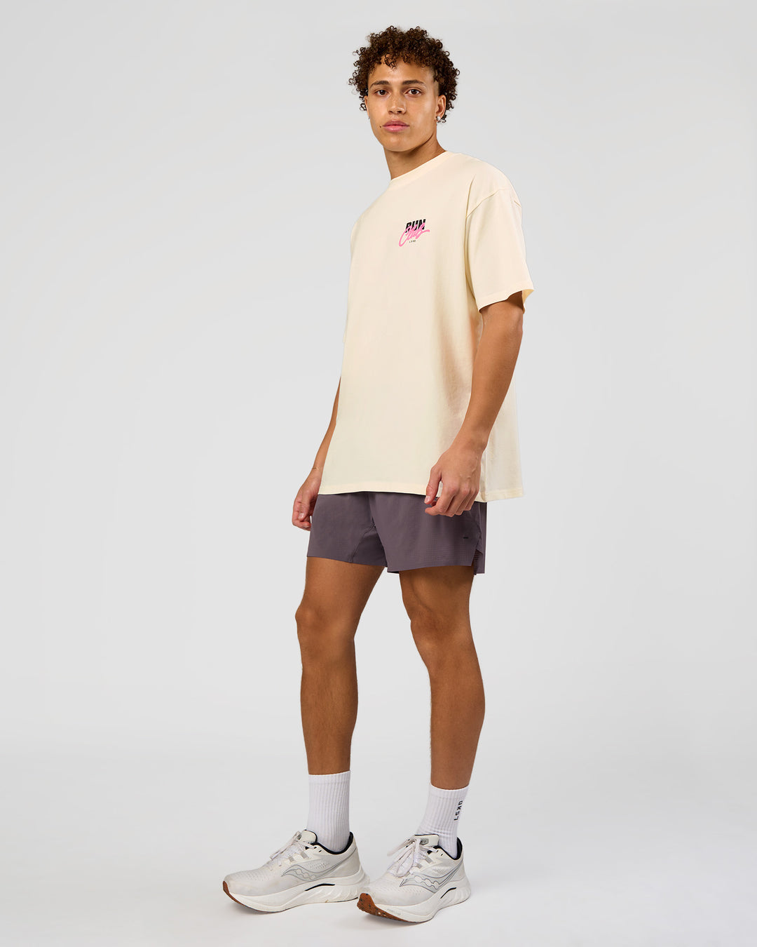 Man wearing Values Run Club FLXCotton Tee - Off White-Candy Pink | Model:Leandro | Size:M