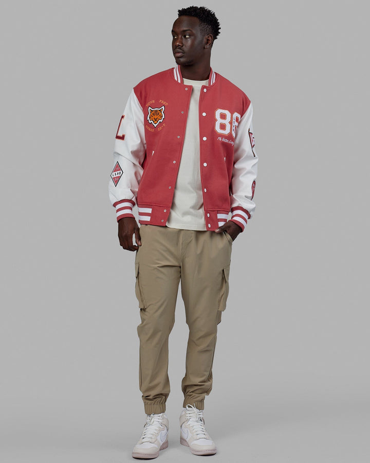 Man wearing Unisex Varsity Bomber Jacket - Mineral Red