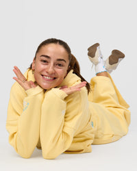 Woman wearing Zola Oversized Hoodie - Lemon | Model:Grace | Size:M