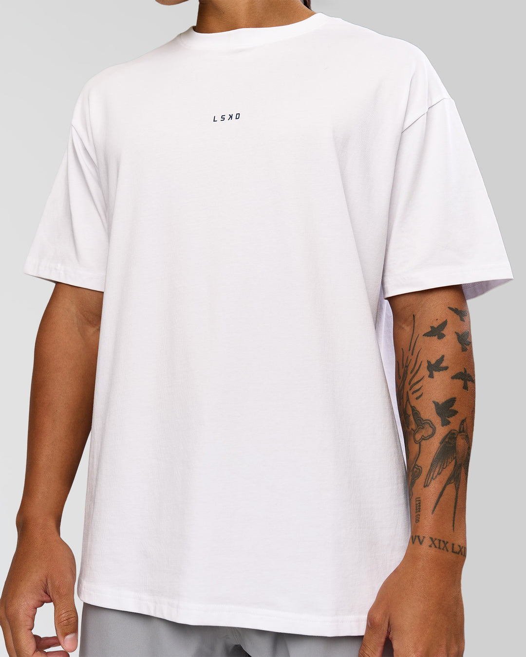Man wearing Woman wearing Run Like The Wind FLXCotton Oversized Tee - White-Future Navy | Model:Malebo | Size:M