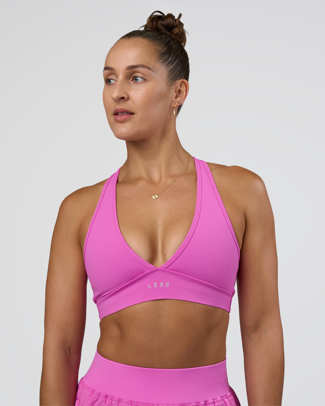 Woman wearing Stamina Sports Bra - Ultra Fuchsia | Model:Abbey | Size:M