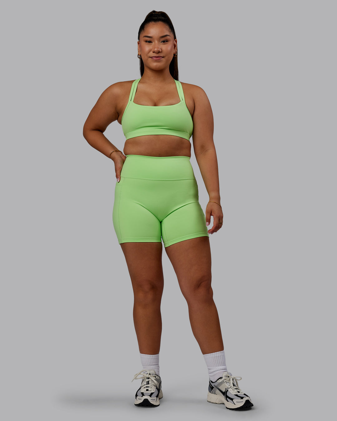 Woman wearing Bree Masters Fusion Ultra High-Rise 6&quot; Short Pockets - Pastel Lime