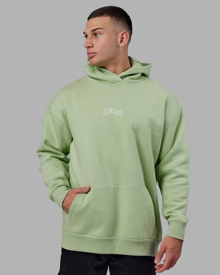 Man wearing Mad Happy Hoodie Oversize - Green Fig