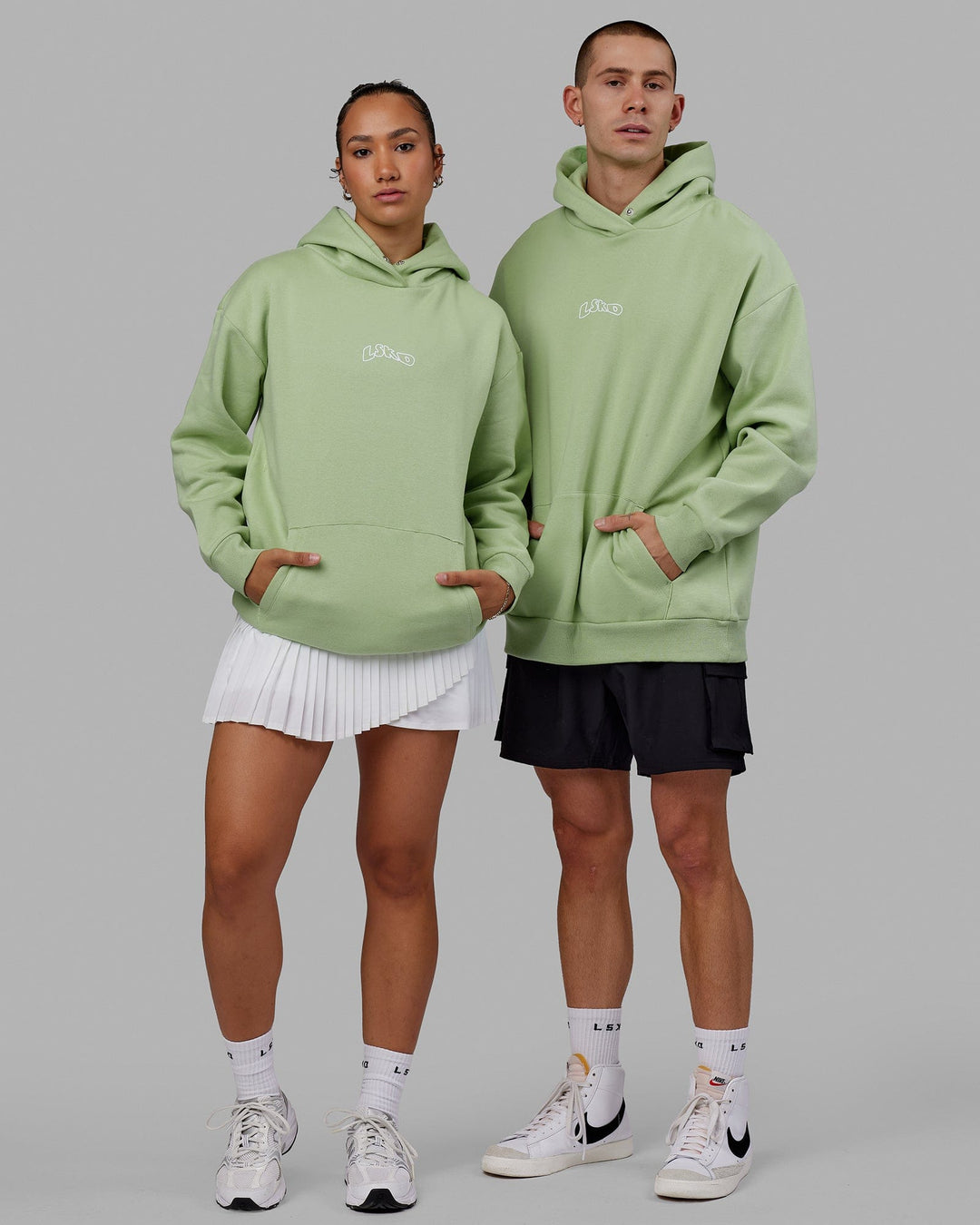 Duo wearing Mad Happy Hoodie Oversize - Green Fig
