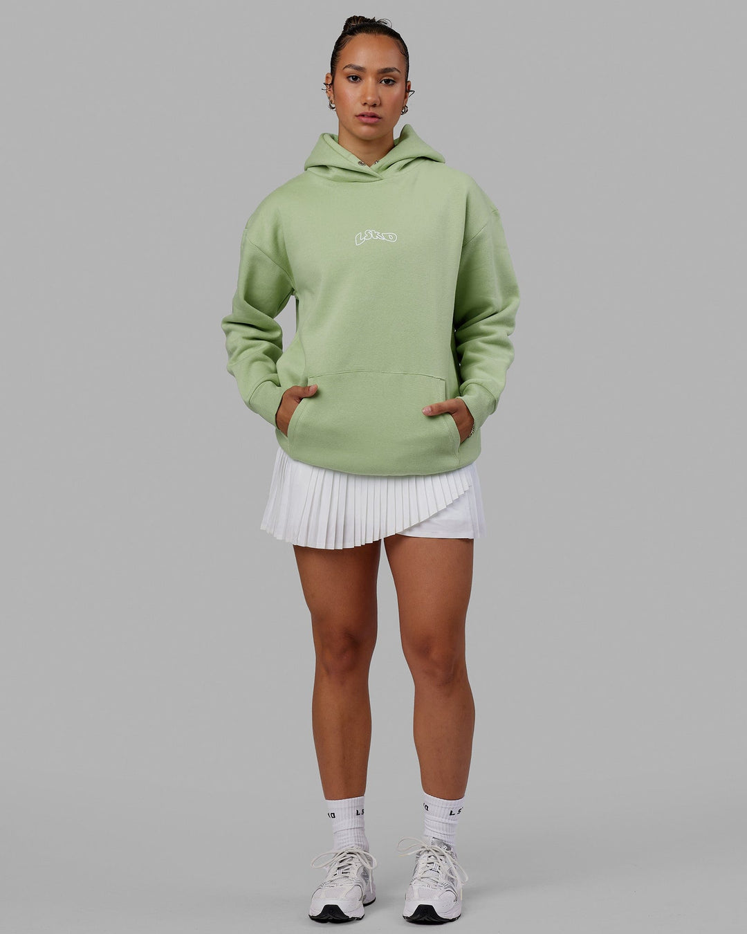 Woman wearing Mad Happy Hoodie Oversize - Green Fig
