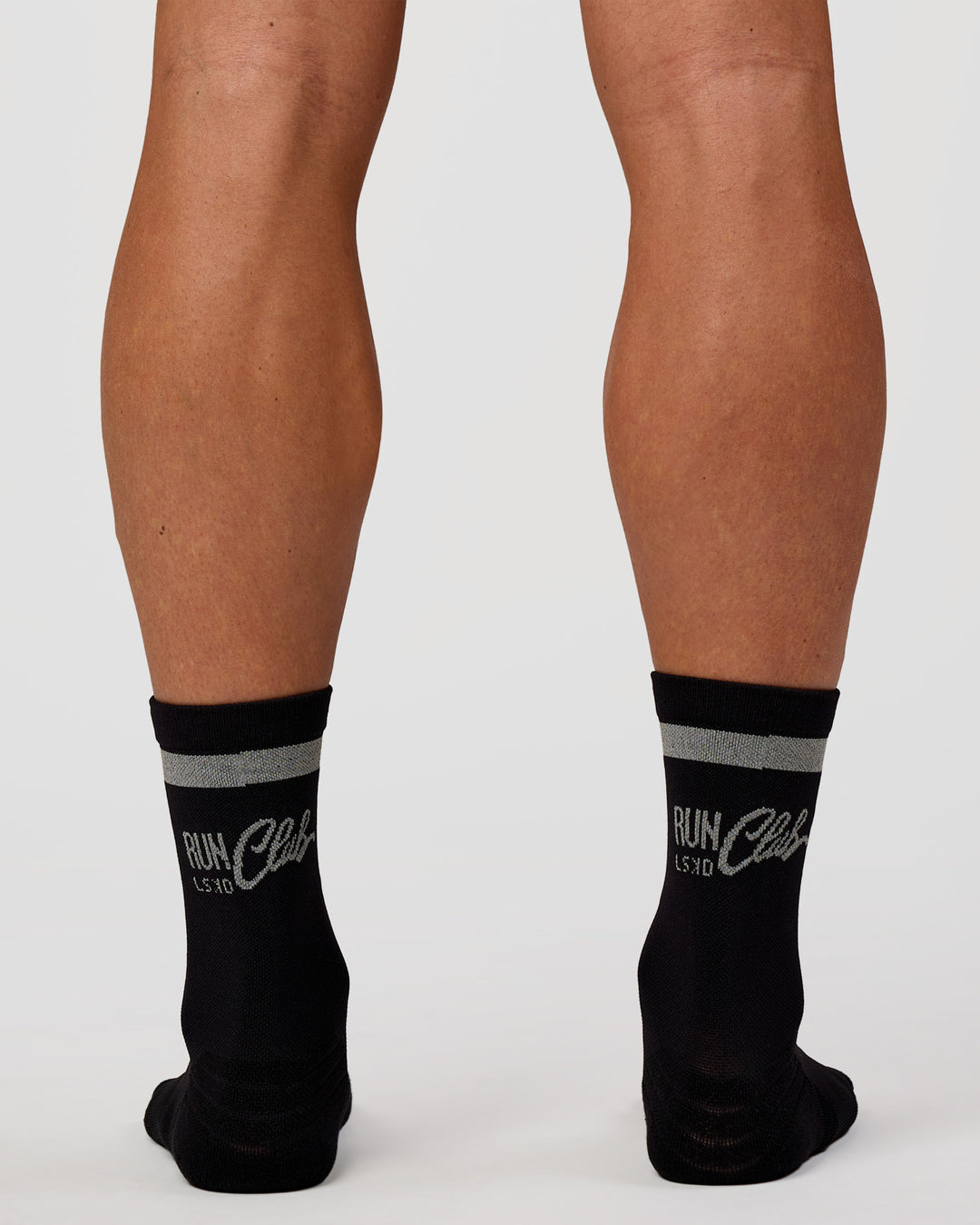 Man wearing Run Club Fast Performance Socks 2.0 - Black-Reflective