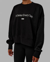 Woman wearing 1% Better Heavyweight Sweater - Black-White