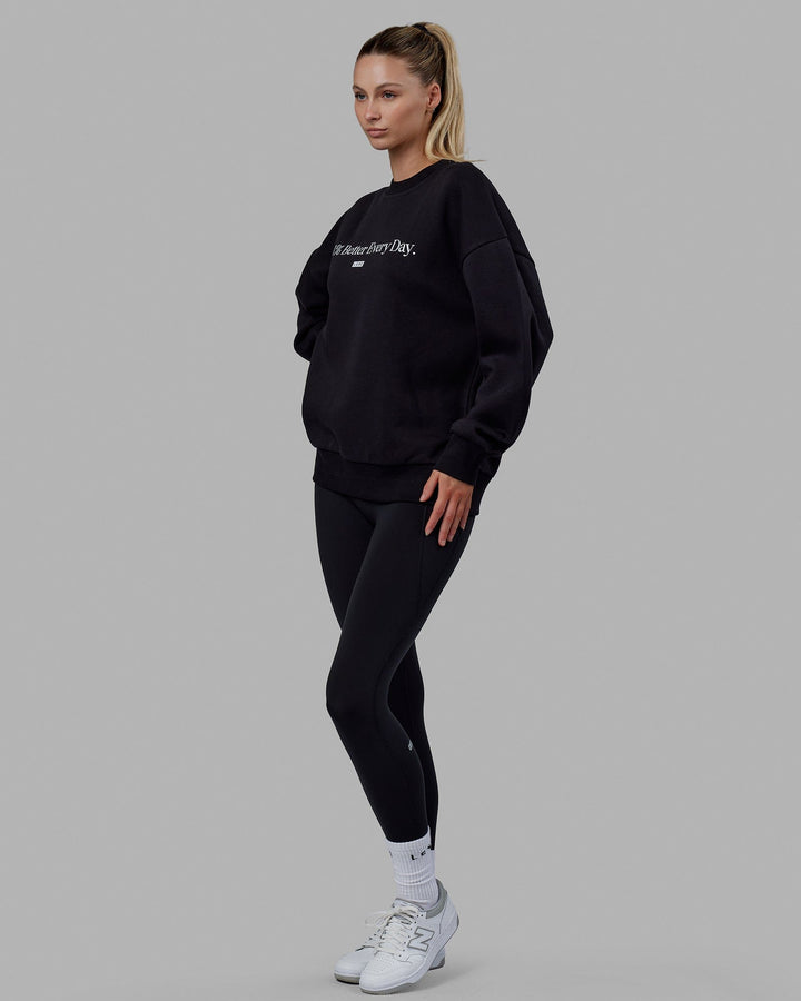 Woman wearing Unisex 1% Better Sweater Oversize - Black-White