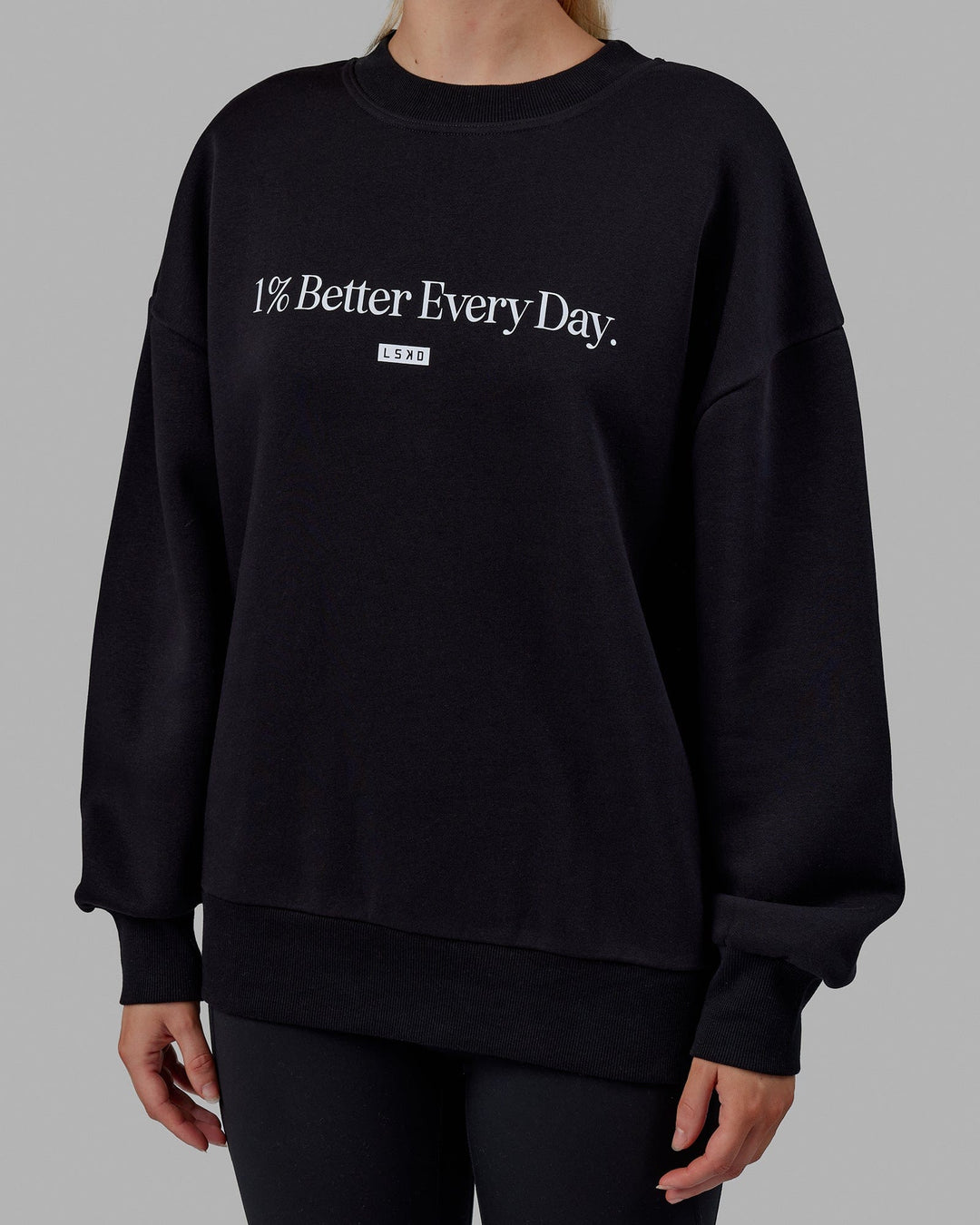 Woman wearing Unisex 1% Better Sweater Oversize - Black-White