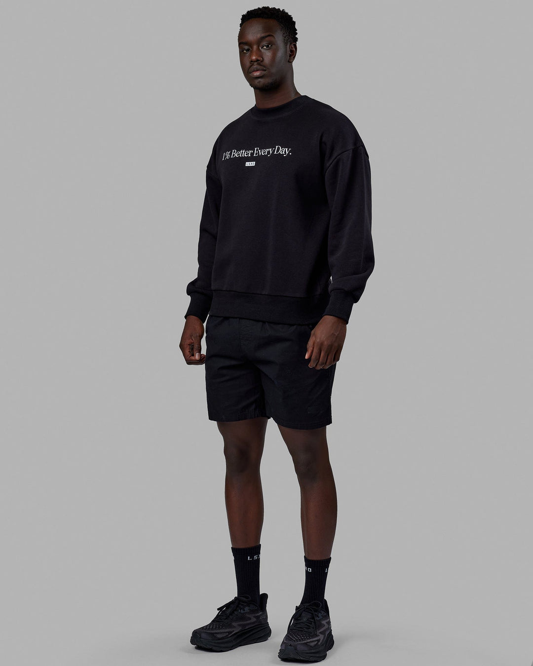 Man wearing Unisex 1% Better Sweater Oversize - Black-White