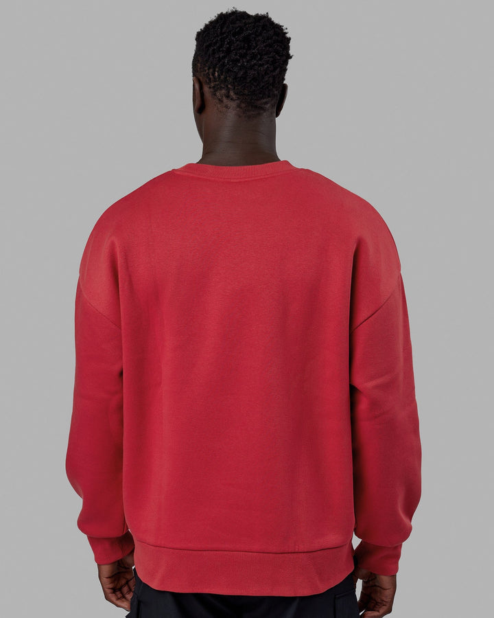 Man wearing Unisex 1% Better Sweater Oversize - Cardinal