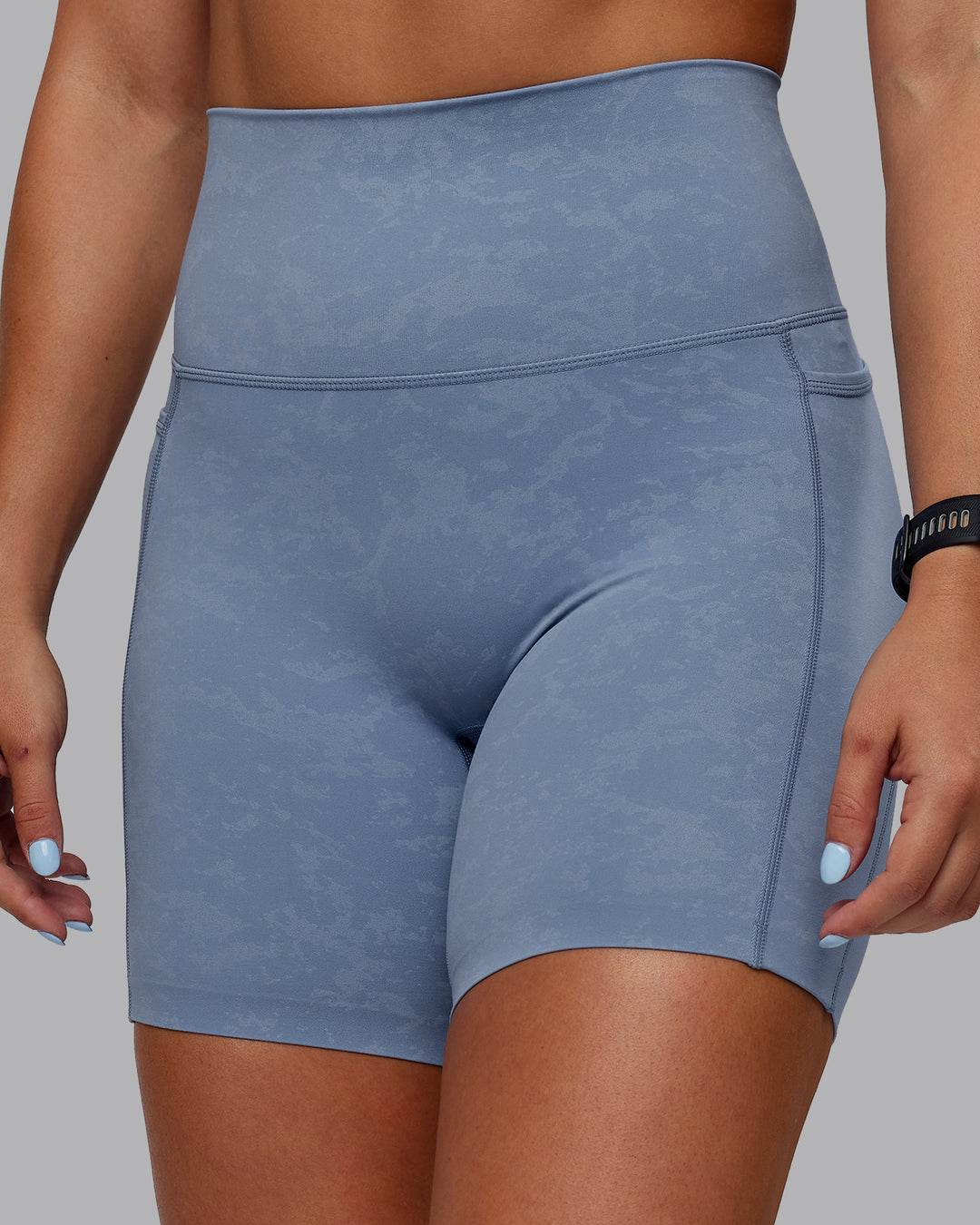 Woman wearing Abs Elixir Ultra High-Rise 6&quot; Short Pockets - Infinity Mirage