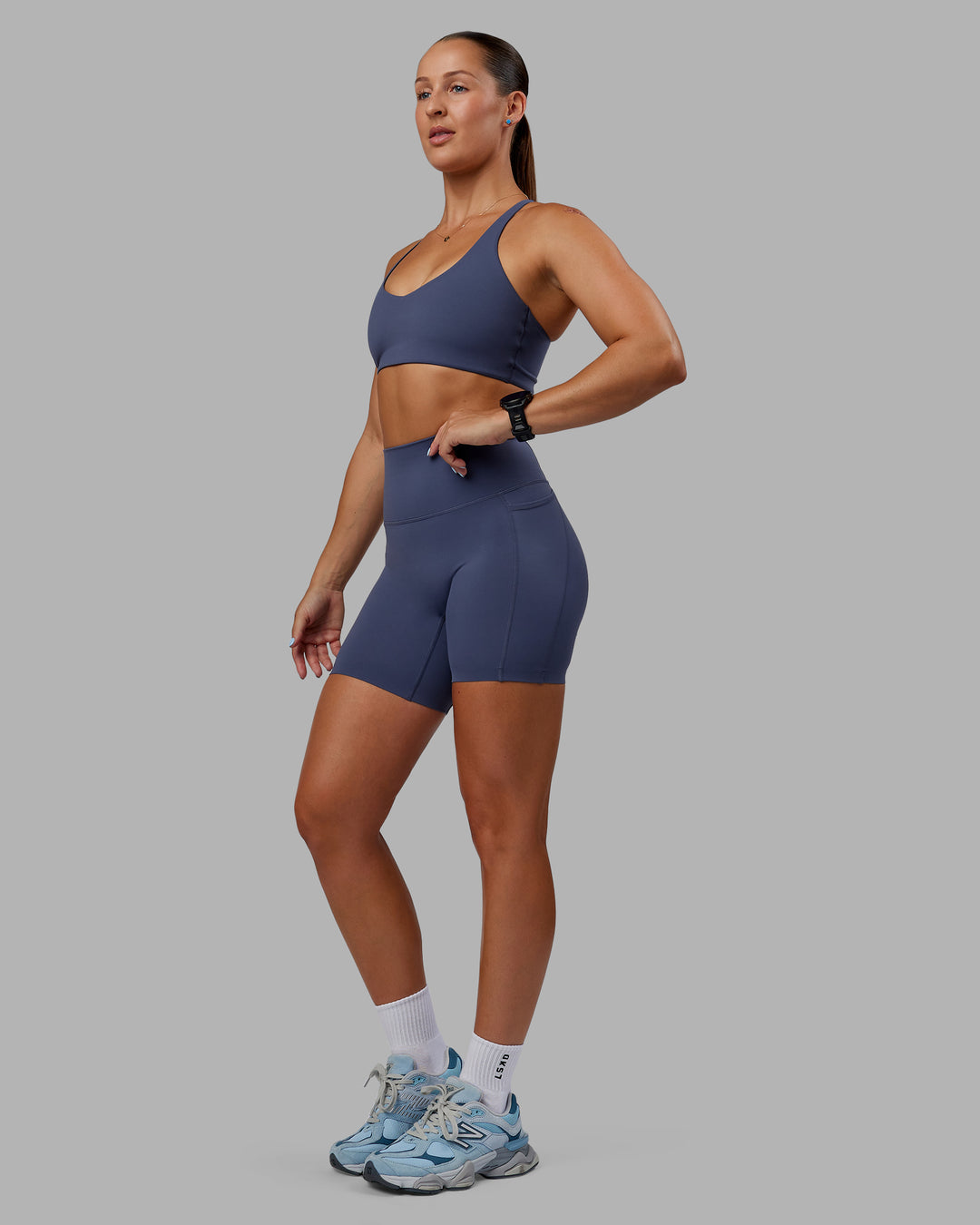 Woman wearing Abs Elixir Ultra High-Rise 6" Short Pockets - Nightshadow Blue