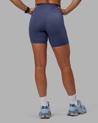 Woman wearing Abs Elixir Ultra High-Rise 6" Short Pockets - Nightshadow Blue