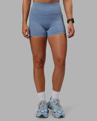 Woman wearing Abs Elixir Ultra High-Rise 4" Short Pockets - Infinity Mirage