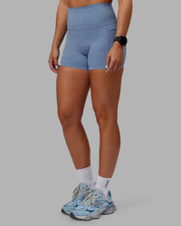 Woman wearing Abs Elixir Ultra High-Rise 4" Short Pockets - Infinity Mirage