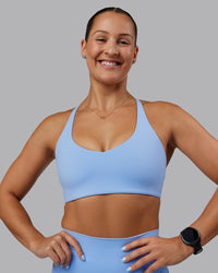 Woman wearing Abs Movement Sports Bra - Open Air