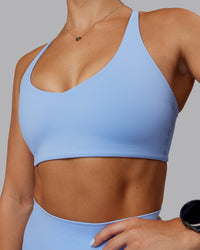 Woman wearing Abs Movement Sports Bra - Open Air