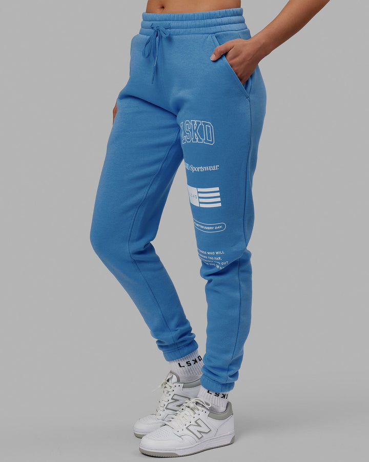 Woman wearing Unisex Academy Track Pant - Azure Blue
