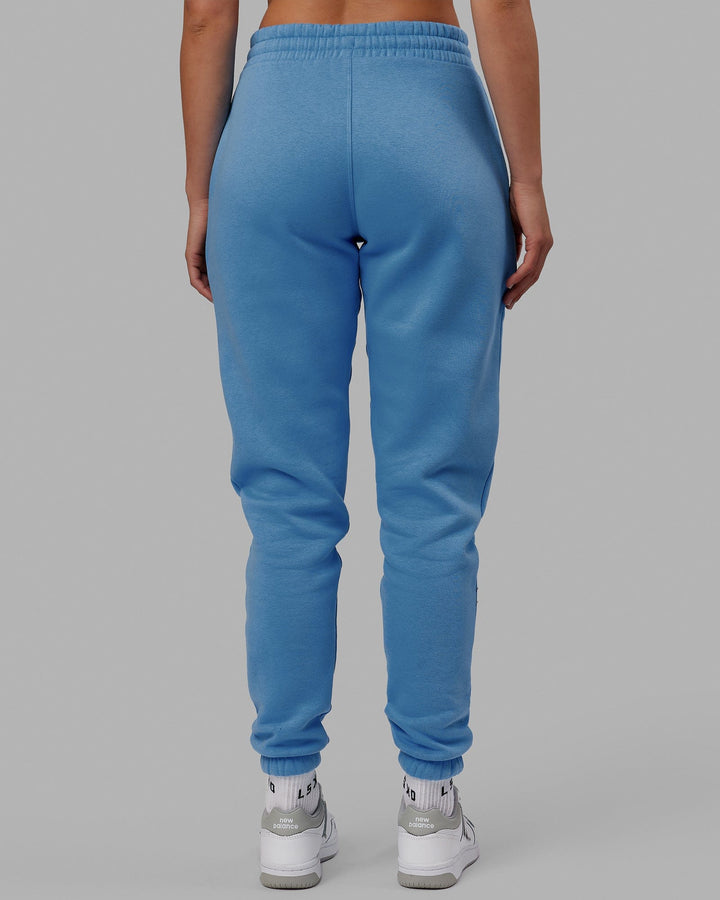 Woman wearing Unisex Academy Track Pant - Azure Blue