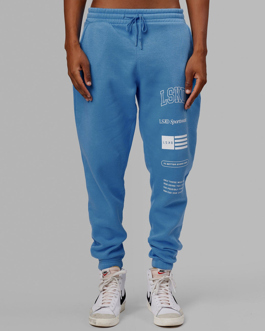 Man wearing Unisex Academy Track Pant - Azure Blue