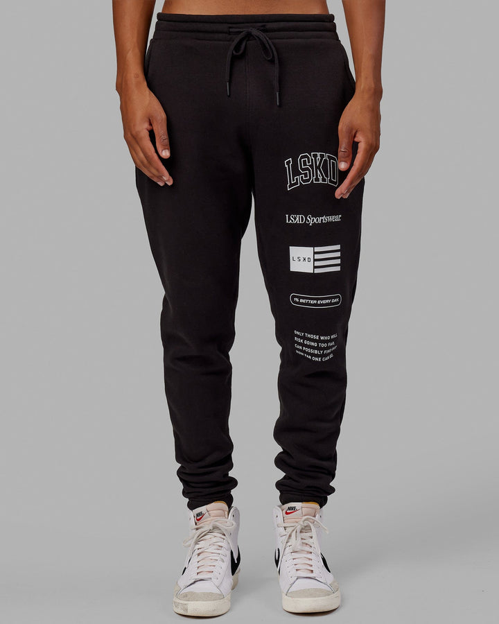 Man wearing Unisex Academy Track Pant - Black