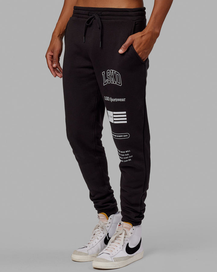 Man wearing Unisex Academy Track Pant - Black