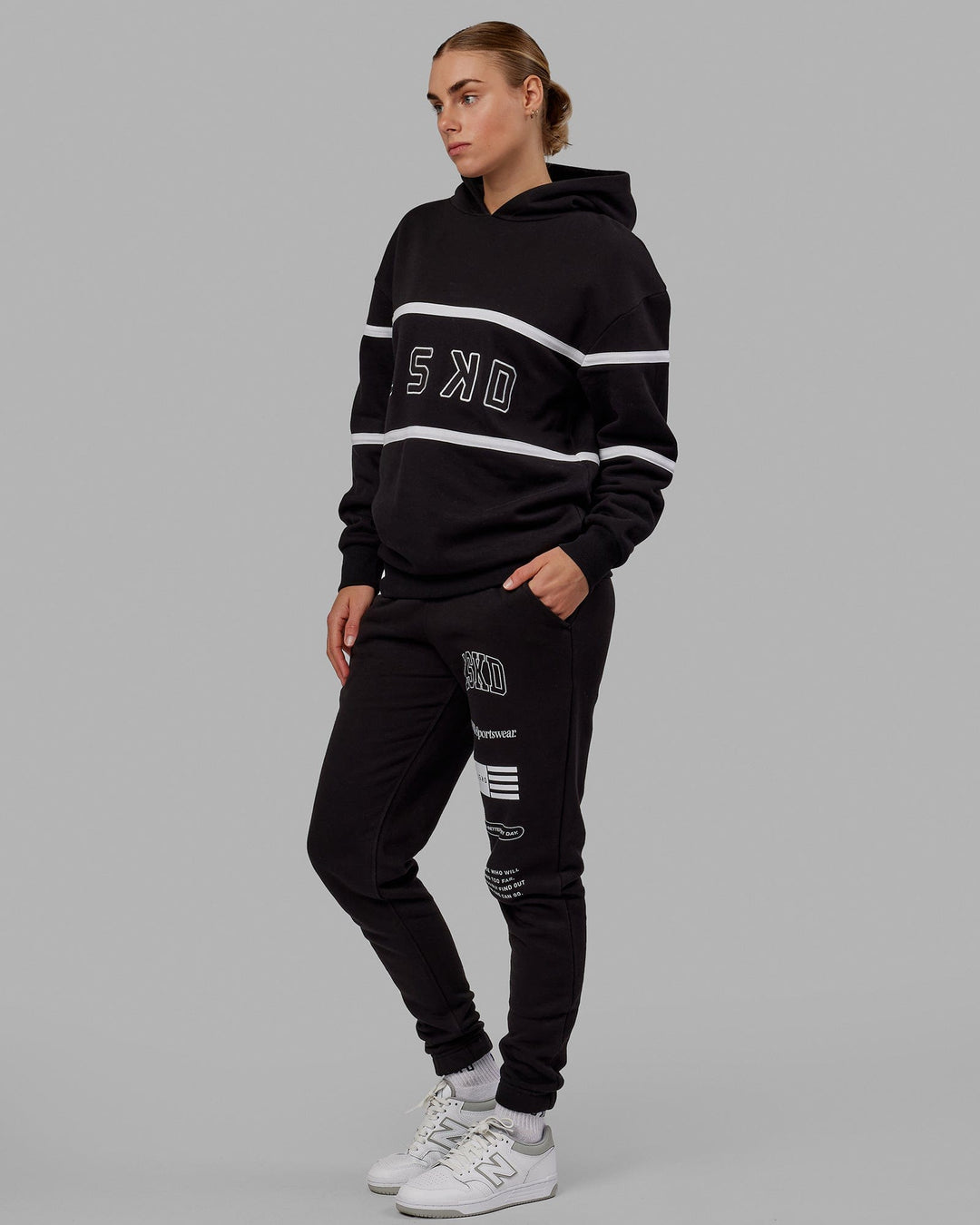 Woman wearing Unisex Academy Track Pant - Black