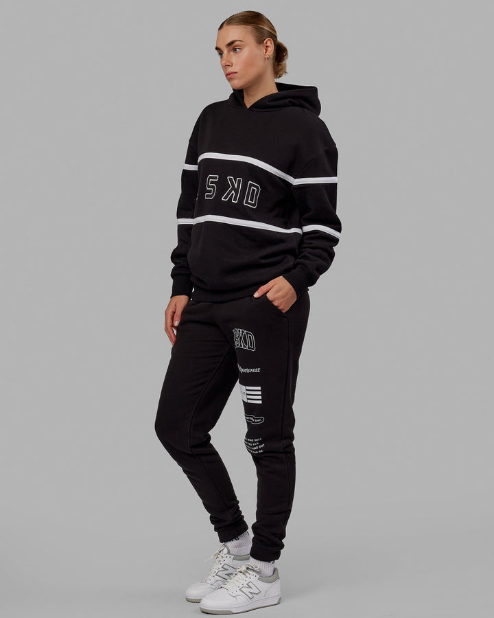 Woman wearing Unisex Academy Track Pant - Black