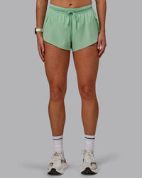 Woman wearing Accelerate 3" Run Shorts - Surreal Green